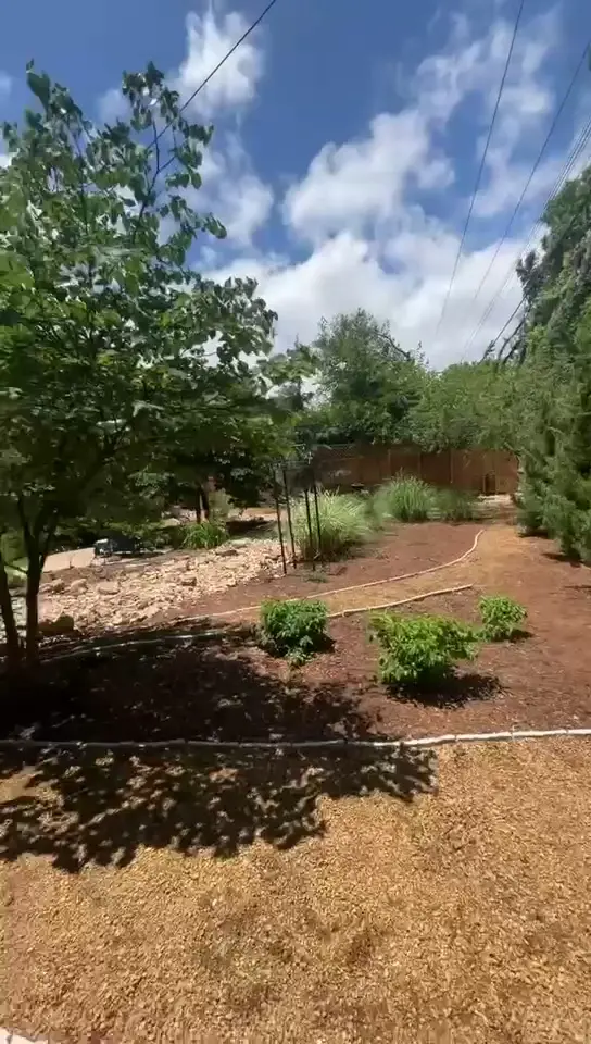Mulched landscaping bed with curved path Oklahoma City